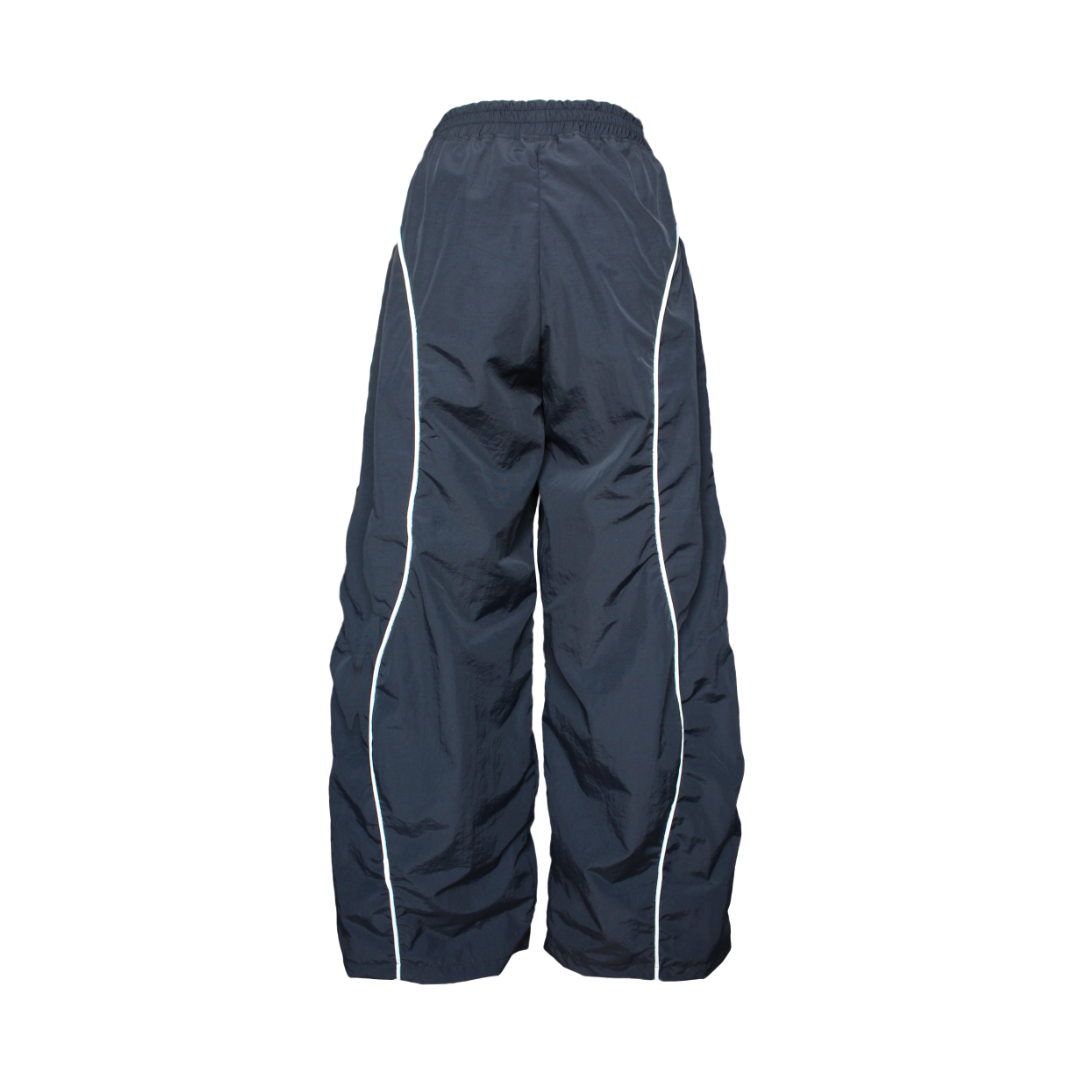 Navy blue pants with white piping on a white background